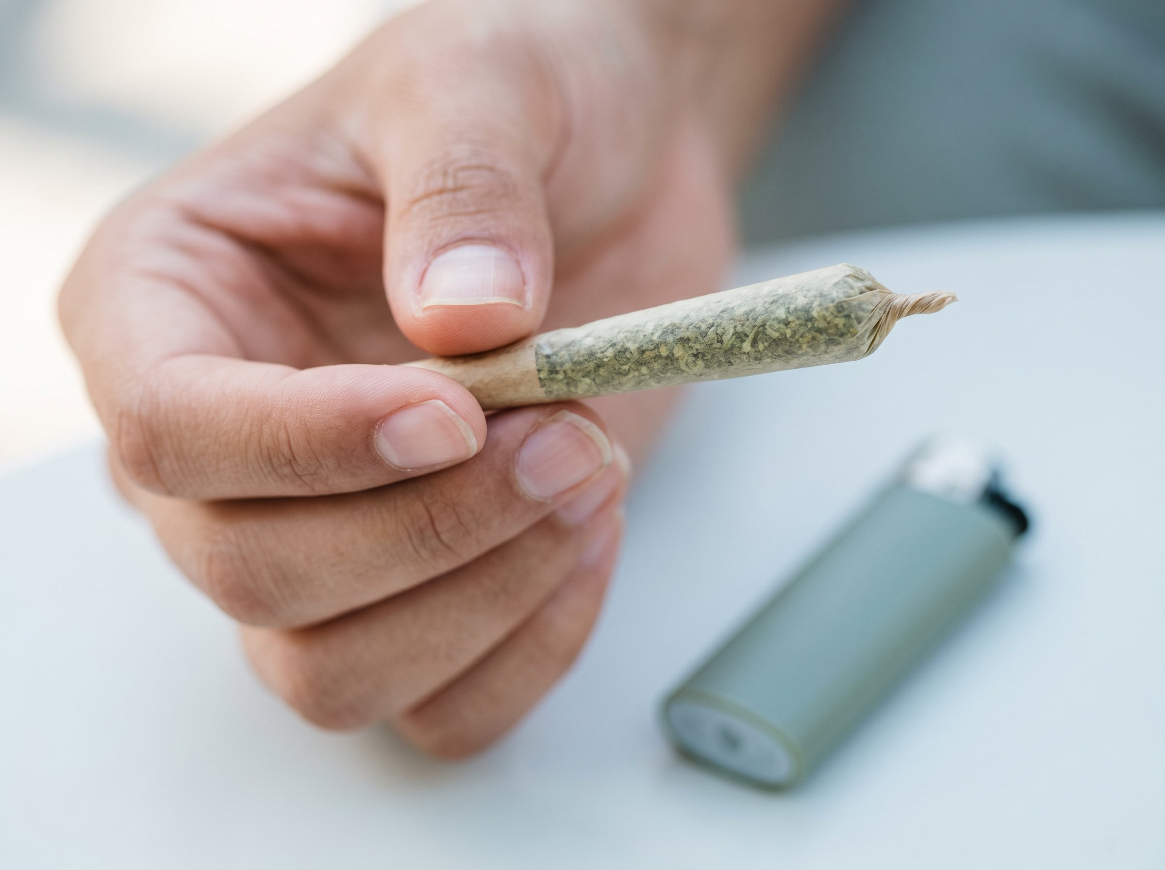Best beginner-friendly low-THC strains displayed with cannabis buds and strain names